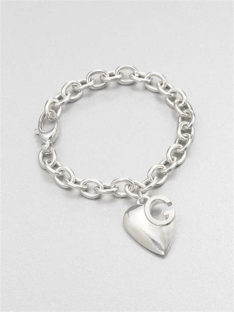 gucci sterling silver heart bracelet|Gucci trademark heart silver bracelet.